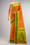 Pure Silk Pure Zari Orange Kanjivaram Saree with Jacquard design on the body and Zari And Thread Border.  displayed on a mannequin