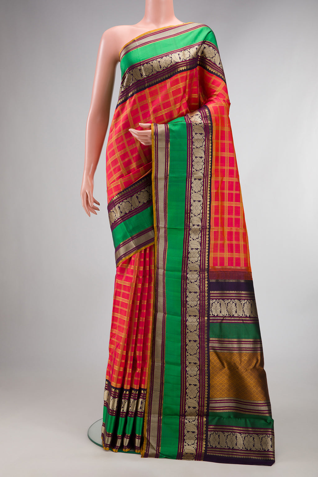 Pure Silk Pure Zari Coral Dual Tone Kanchipuram Saree with Checked design on the body and Zari And Thread Border.  displayed on a mannequin