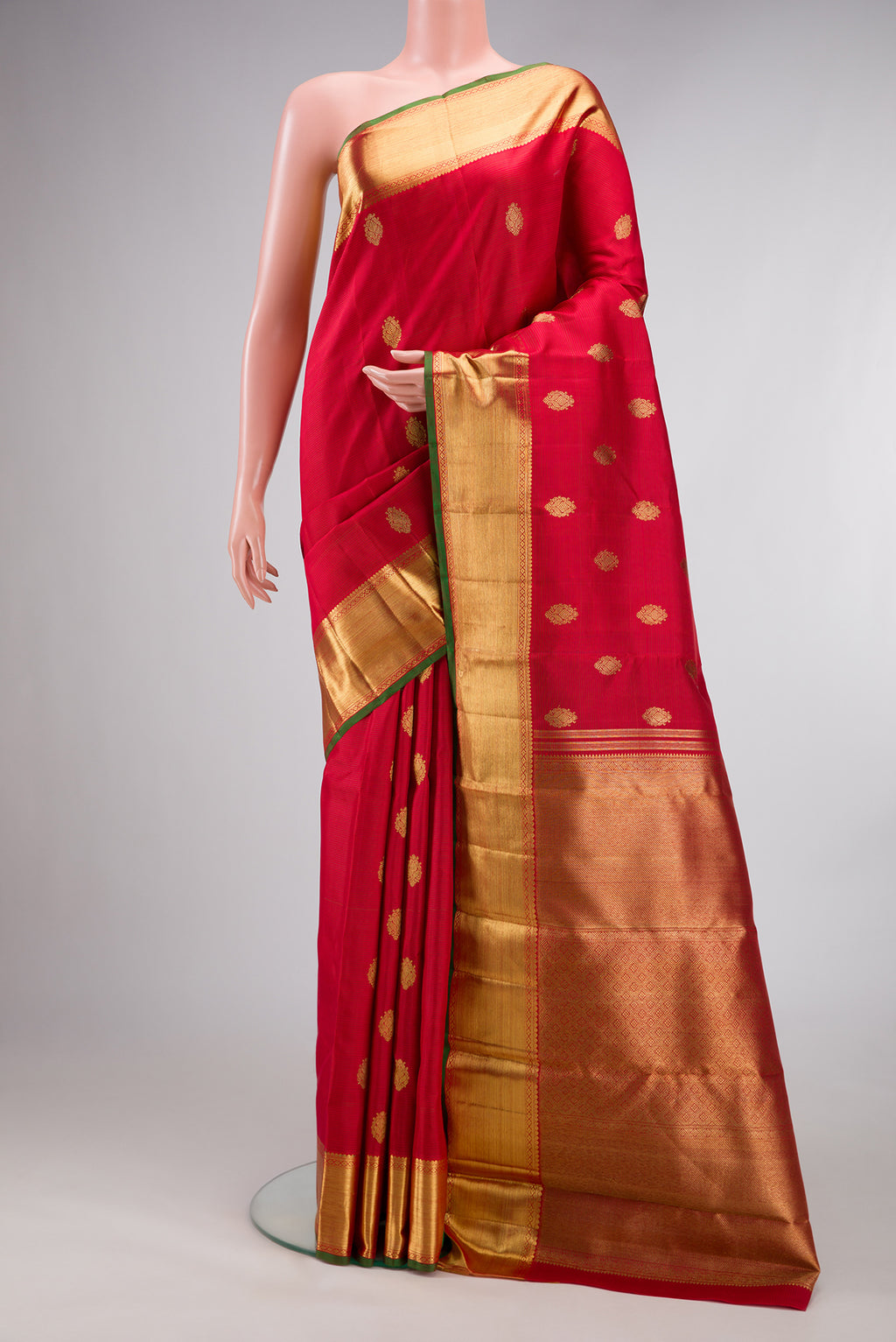 Pure Silk Pure Zari Red Kanjivaram Saree with Stripes on the body and Zari Border.  displayed on a mannequin