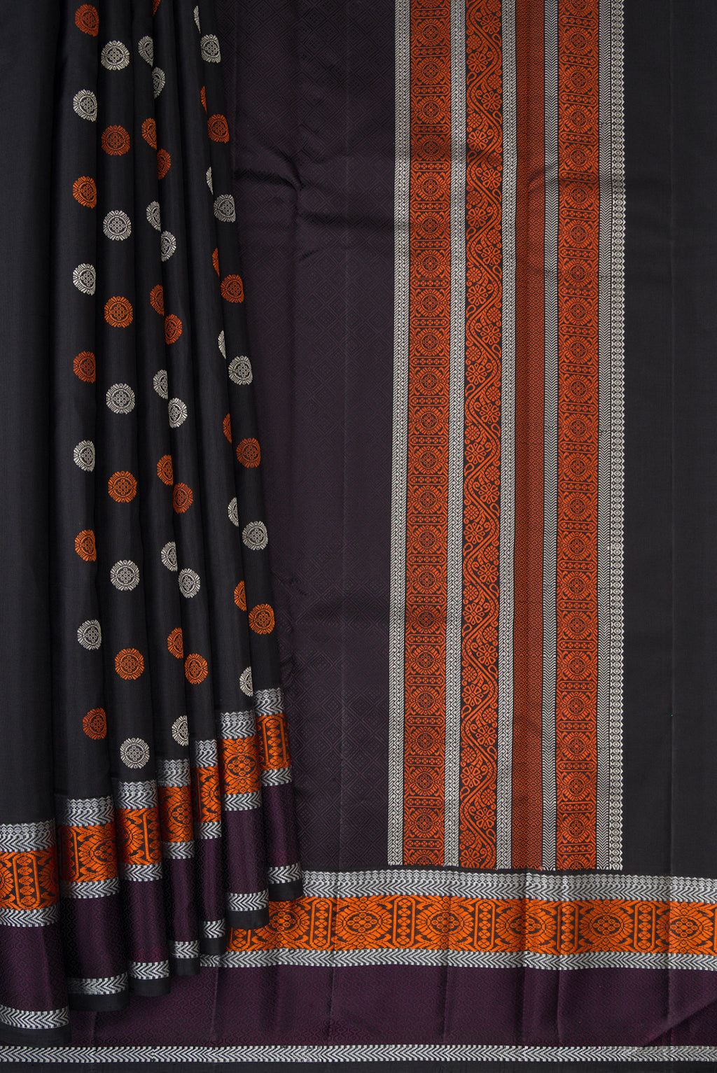 Pleats and pallu of Pure Silk Black Kanjivaram Saree with Thread Butta on the body and Thread Border. 