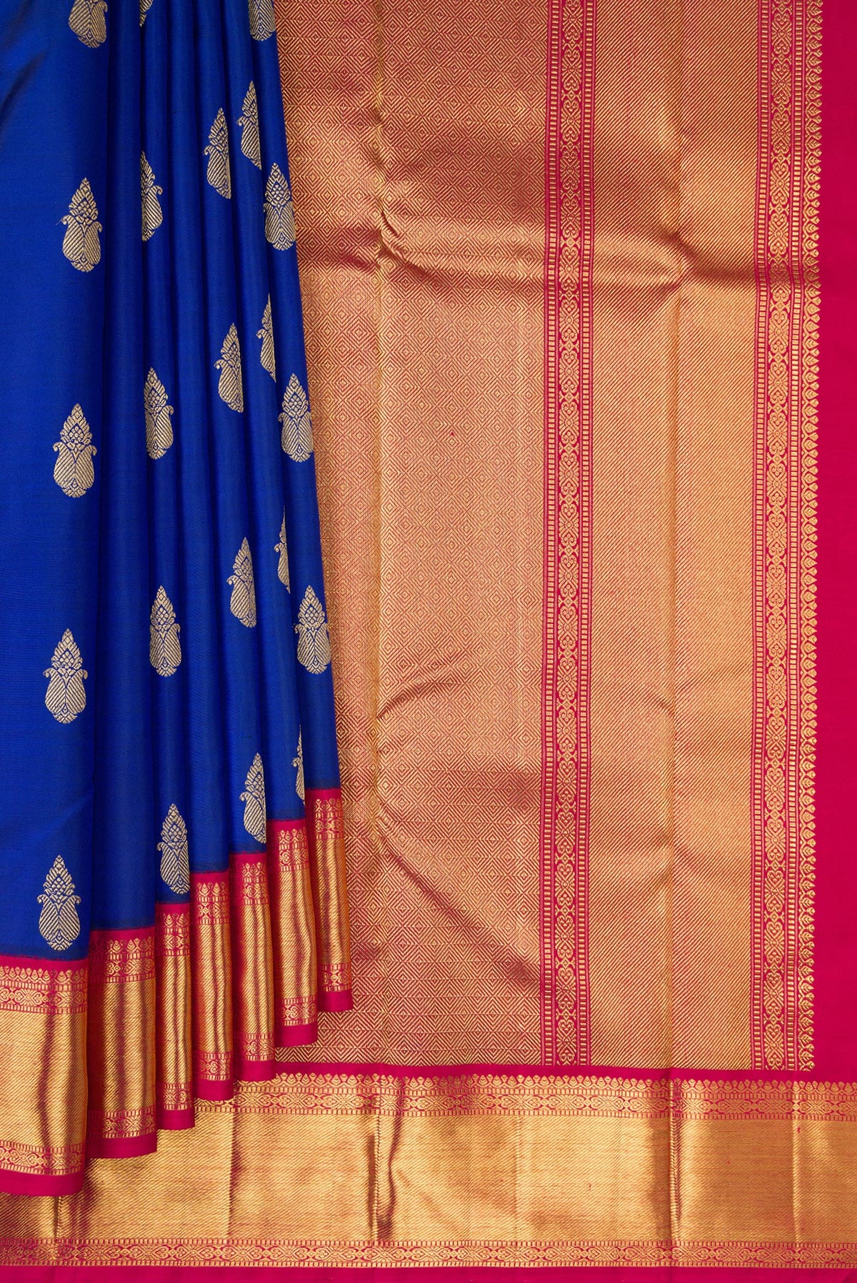 Pleats and pallu of Pure Silk Pure Zari Royal Blue Kanjivaram Saree with Zari Butta on the body and Zari Border. 