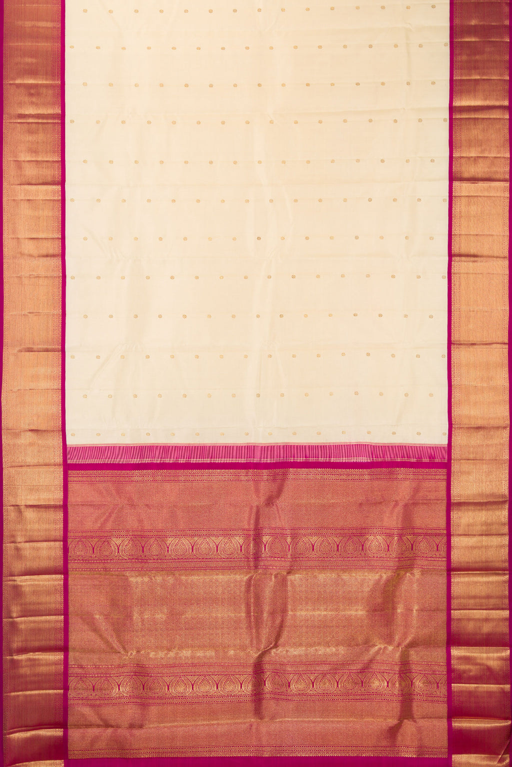 Flat view of Pure Silk Pure Zari Cream Kanjivaram Saree with Zari Butta on the body and Zari Border. 