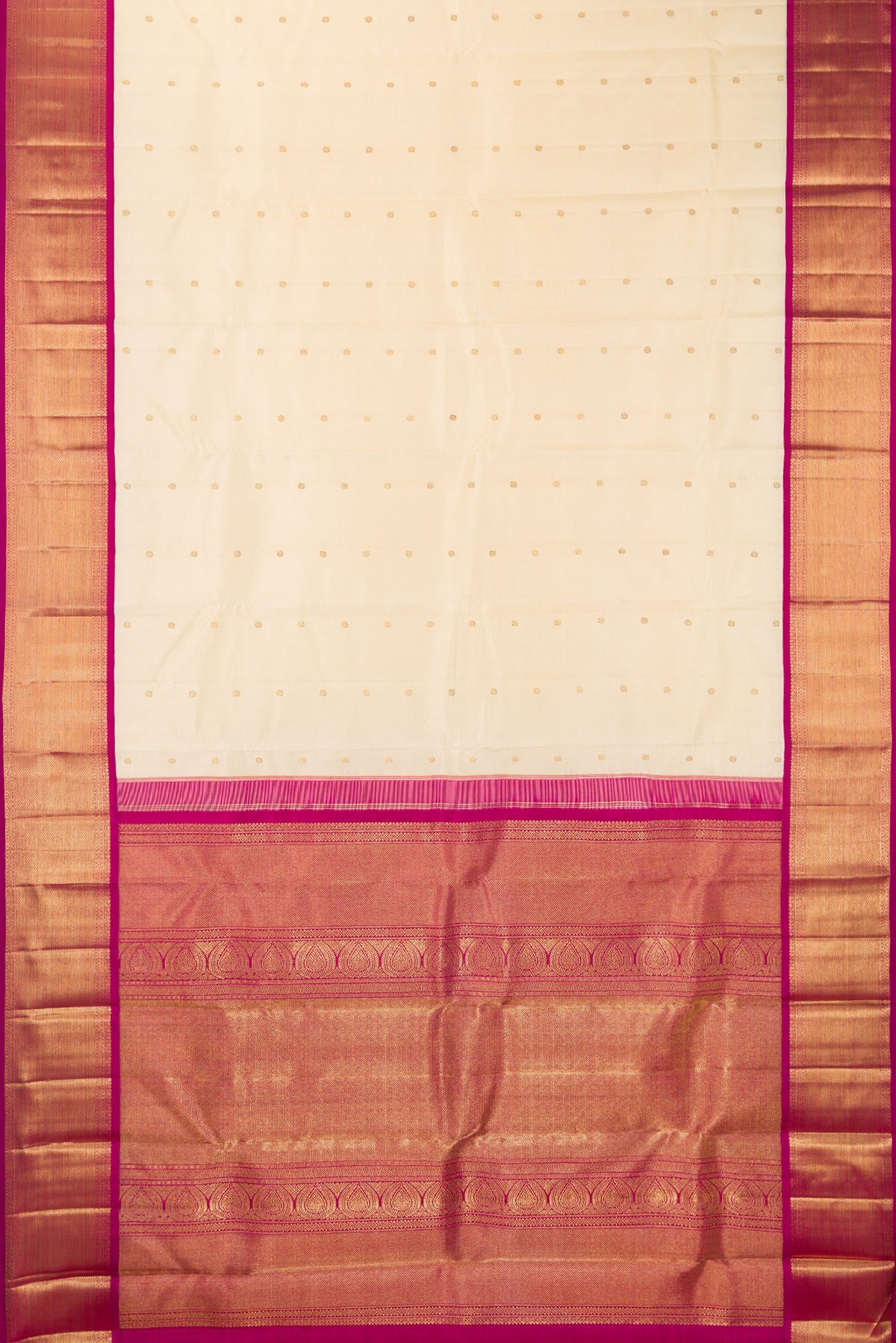 Flat view of Pure Silk Pure Zari Cream Kanjivaram Saree with Zari Butta on the body and Zari Border. 