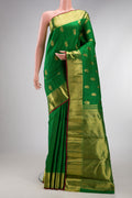 Pure Silk Pure Zari Green Kanjivaram Saree with Zari Butta on the body and Zari Border.  displayed on a mannequin