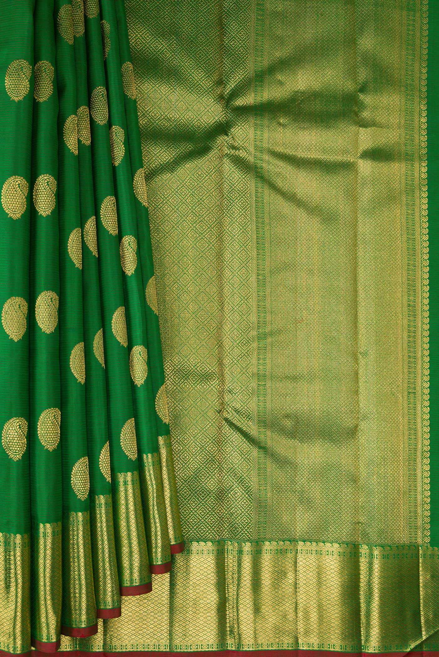 Pleats and pallu of Pure Silk Pure Zari Green Kanjivaram Saree with Zari Butta on the body and Zari Border. 