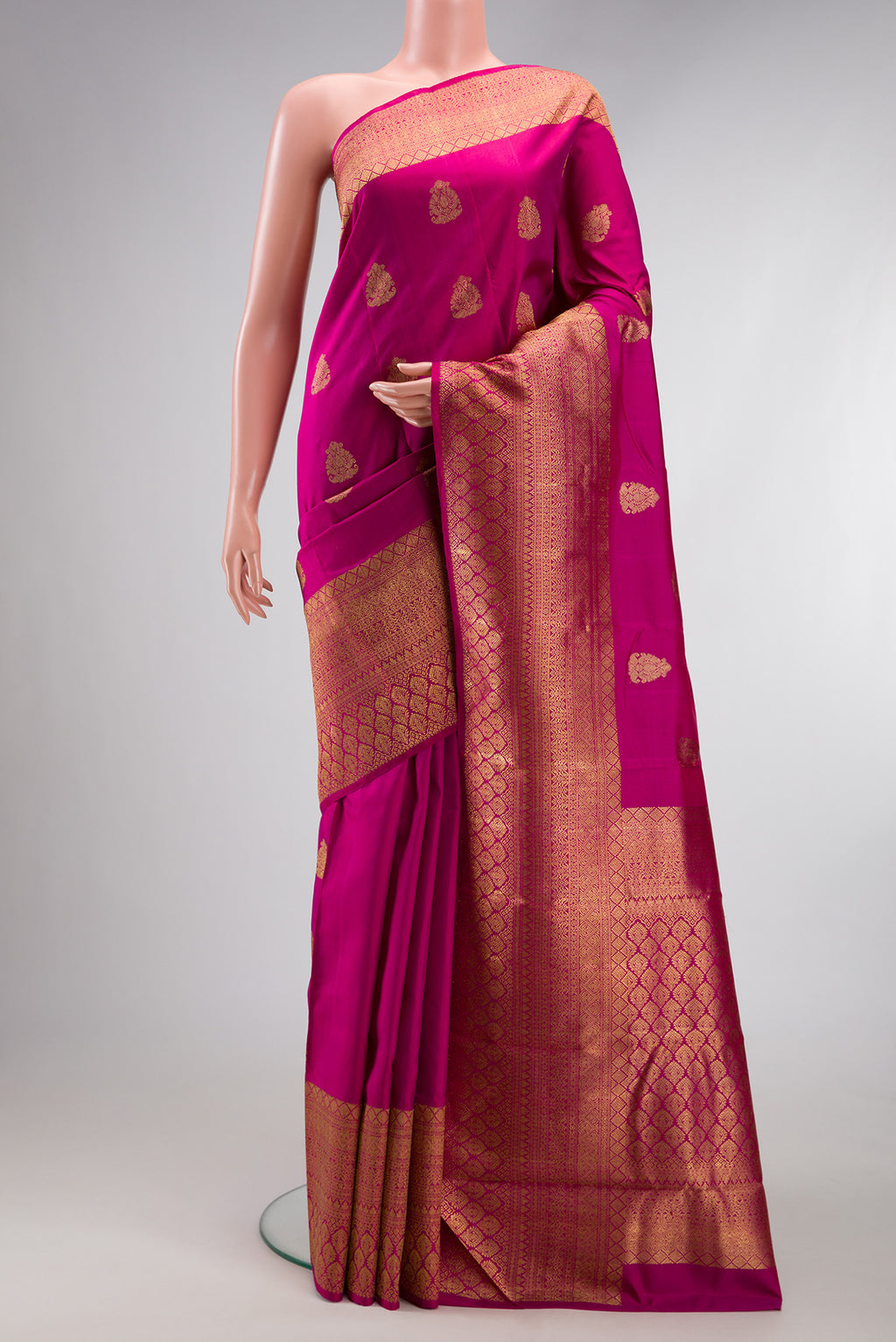 Pure Silk Pure Zari Light Magenta Kanjivaram Saree with Zari Butta on the body and Zari Border.  displayed on a mannequin