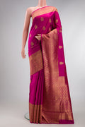 Pure Silk Pure Zari Light Magenta Kanjivaram Saree with Zari Butta on the body and Zari Border.  displayed on a mannequin