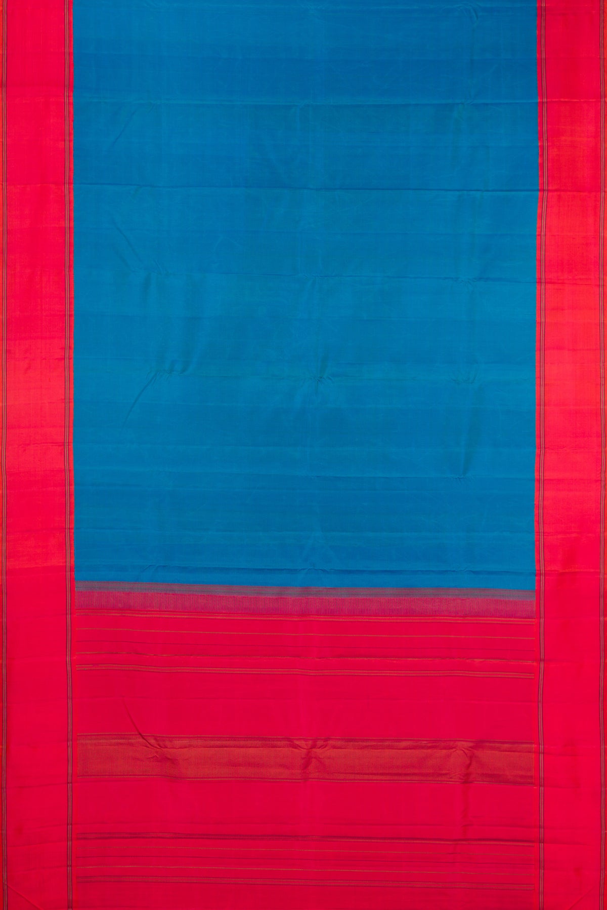 Flat view of Pure Silk Peacock Blue Dual Tone Kanjivaram Saree with Plain Body and Plain Border. 