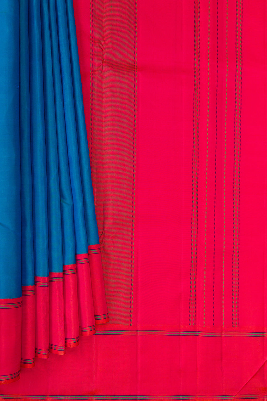 Pleats and pallu of Pure Silk Peacock Blue Dual Tone Kanjivaram Saree with Plain Body and Plain Border. 