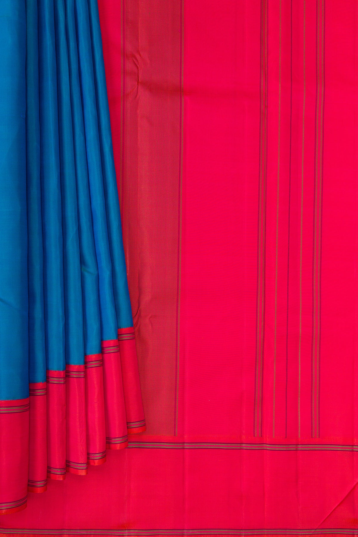 Pleats and pallu of Pure Silk Peacock Blue Dual Tone Kanjivaram Saree with Plain Body and Plain Border. 