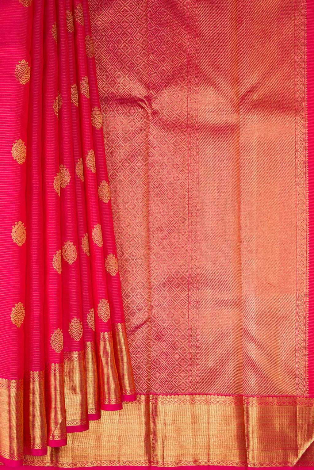 Pleats and pallu of Pure Silk Pure Zari Dark Pink Kanjivaram Saree with Zari Butta on the body and Zari Border. 