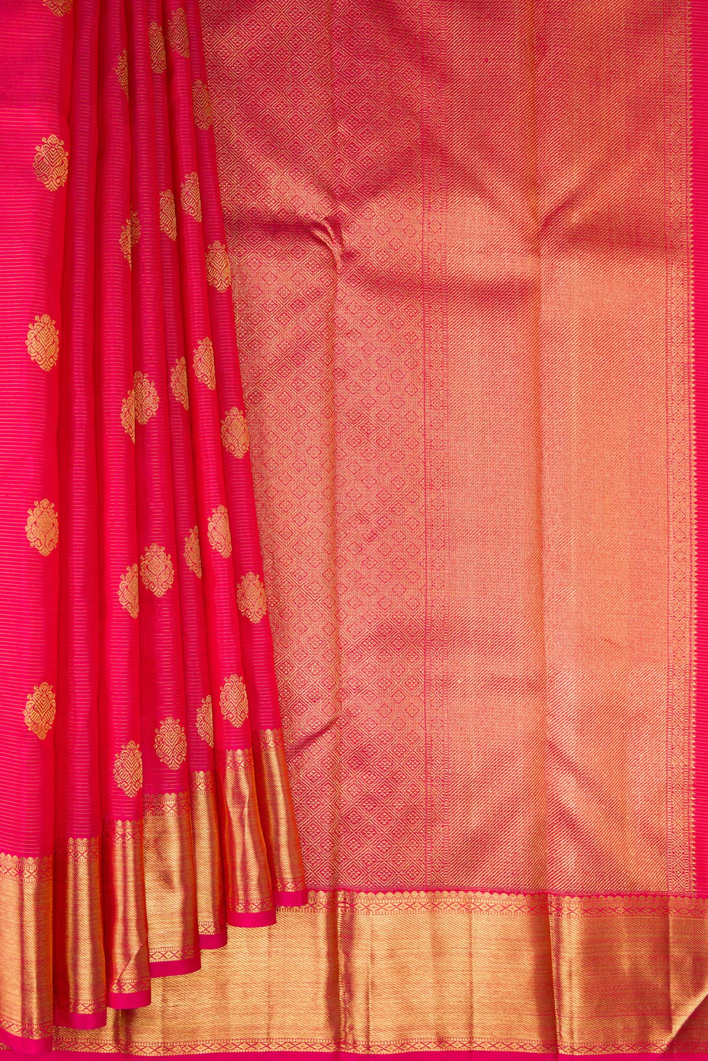 Pleats and pallu of Pure Silk Pure Zari Dark Pink Kanjivaram Saree with Zari Butta on the body and Zari Border. 