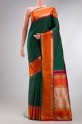 Pure Silk Pure Zari Green Kanjivaram Saree with Plain Body and Zari Border.  displayed on a mannequin