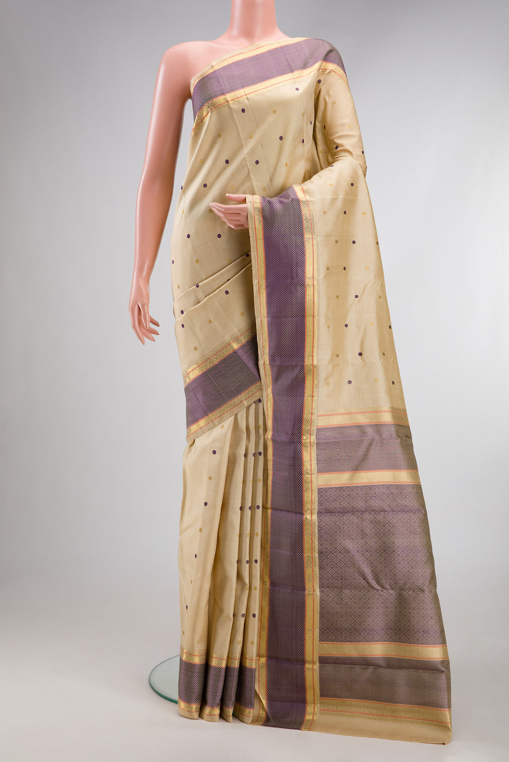 Pure Silk Pure Zari Sandal Kanchipuram Saree with Zari And Thread Butta on the body and Zari Border.  displayed on a mannequin