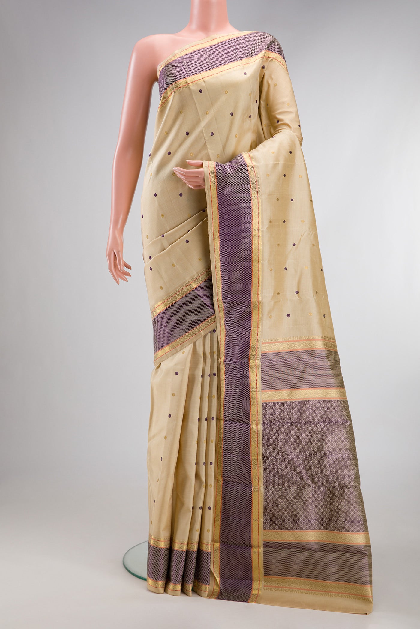 Pure Silk Pure Zari Sandal Kanchipuram Saree with Zari And Thread Butta on the body and Zari Border.  displayed on a mannequin