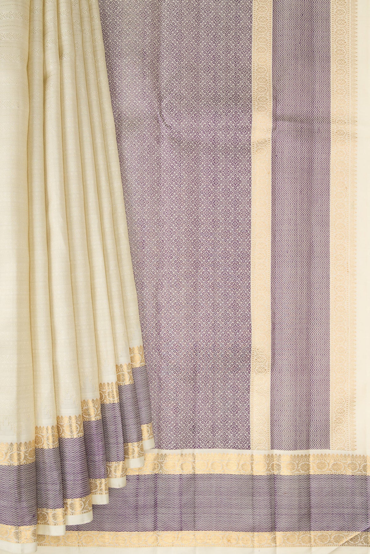 Pleats and pallu of Pure Silk Pure Zari Off White Kanjivaram Saree with Jacquard design on the body and Zari And Thread Border. 