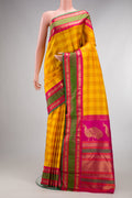 Pure Silk Pure Zari Yellow Kanjivaram Saree with Checked design on the body and Zari Border.  displayed on a mannequin