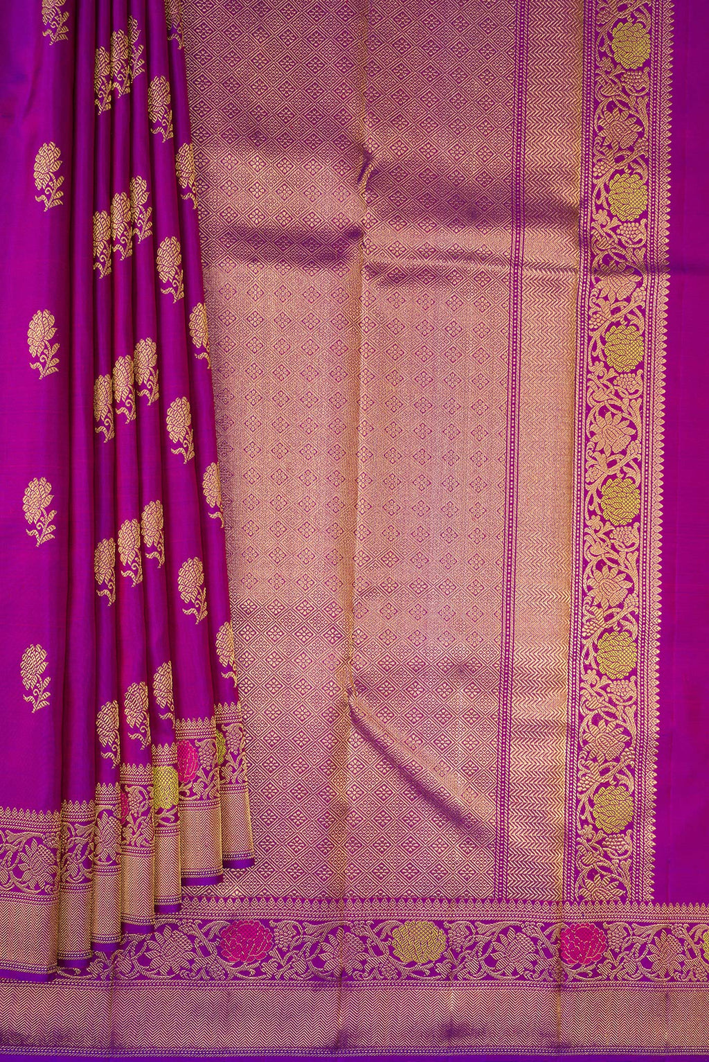 Pleats and pallu of Pure Silk Pure Zari Purple Kanjivaram Saree with Zari Butta on the body and Fancy Border. 