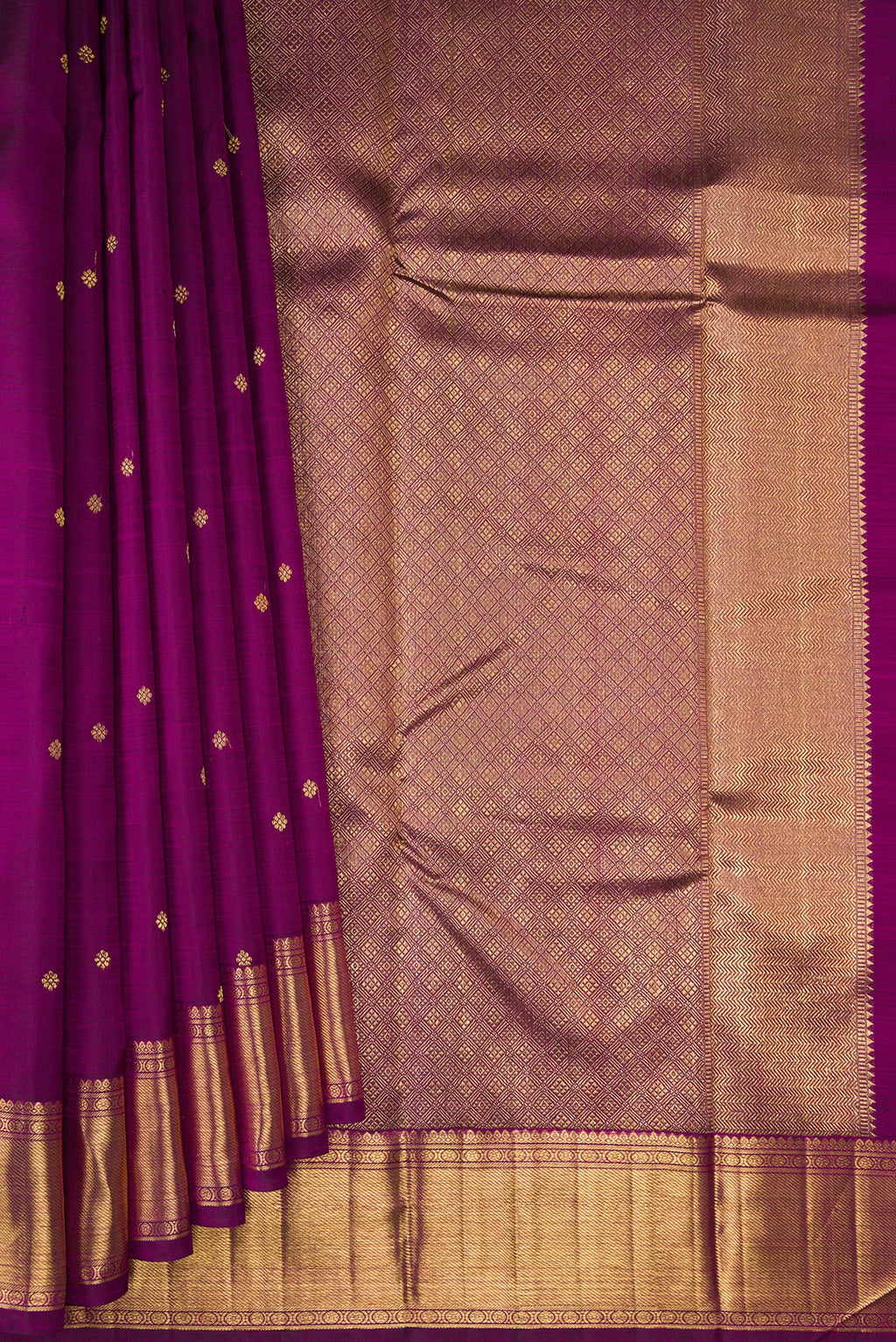 Pleats and pallu of Pure Silk Pure Zari Magenta Kanjivaram Saree with Zari Butta on the body and Zari Border. 