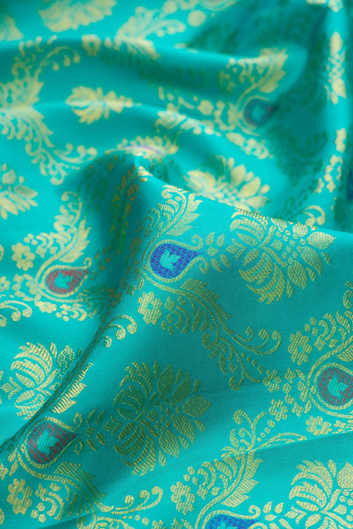 Close up of Pure Silk Blue Kanjivaram Saree with Zari Brocade on the body and Zari Border.  displaying folds