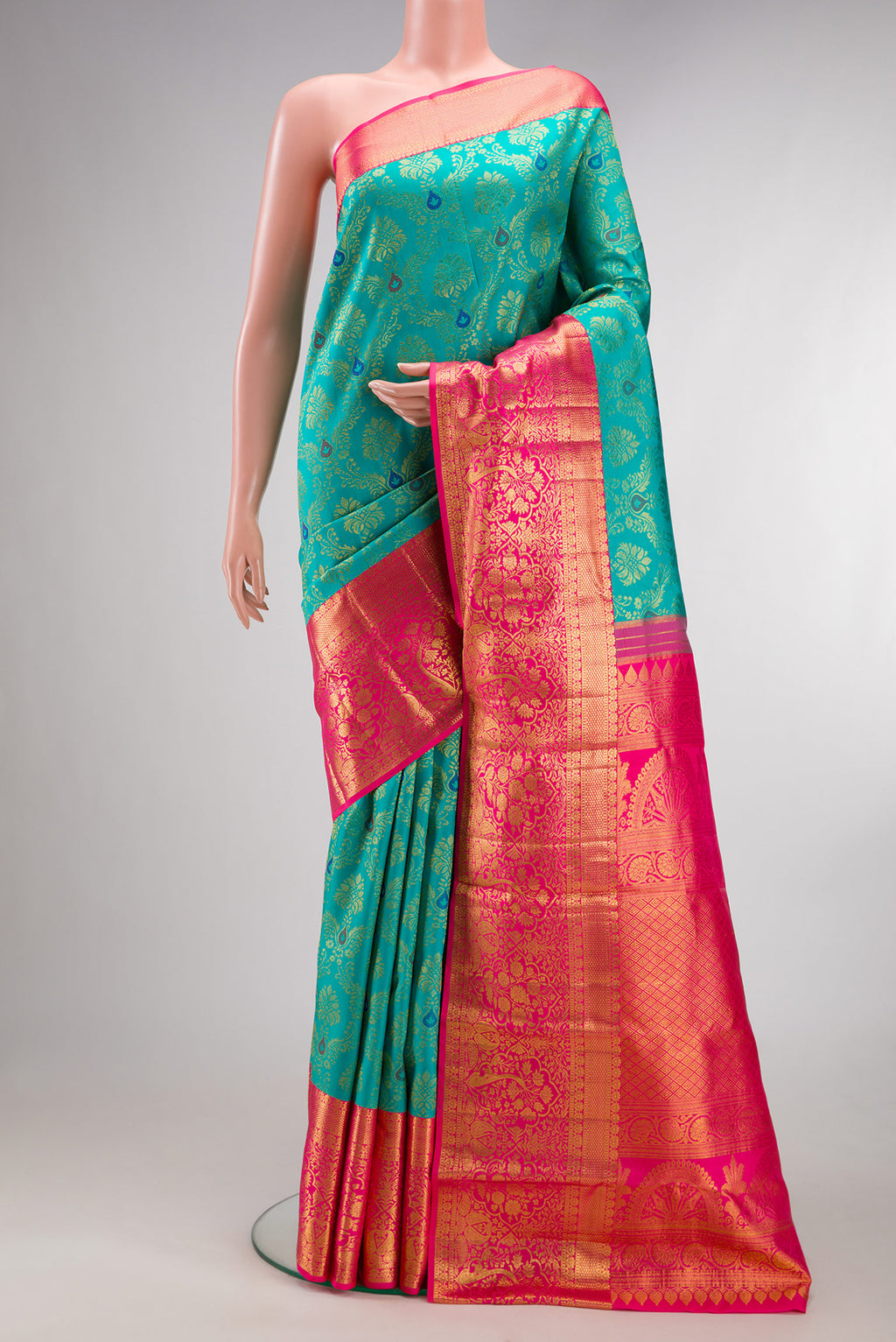 Pure Silk Blue Kanjivaram Saree with Zari Brocade on the body and Zari Border.  displayed on a mannequin