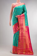 Pure Silk Blue Kanjivaram Saree with Zari Brocade on the body and Zari Border.  displayed on a mannequin