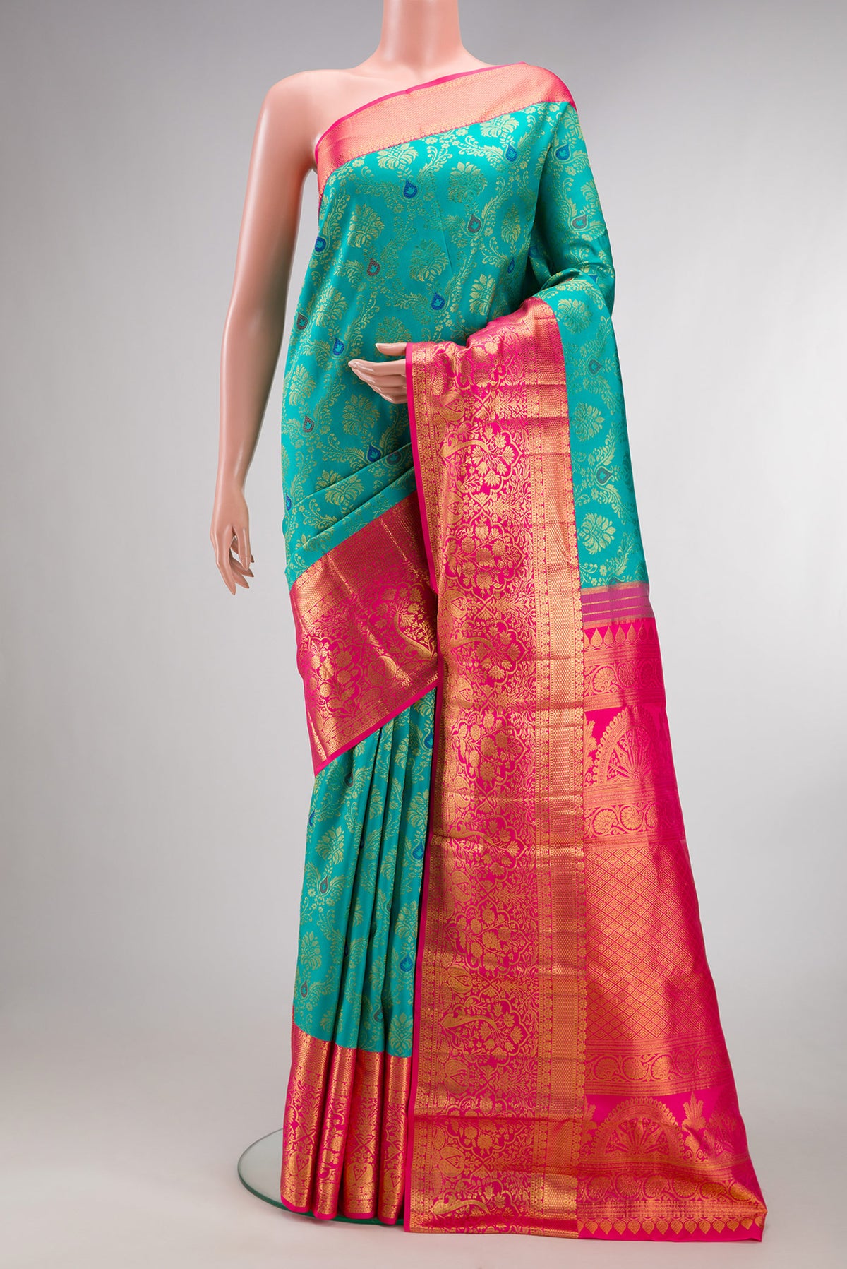 Pure Silk Blue Kanjivaram Saree with Zari Brocade on the body and Zari Border.  displayed on a mannequin