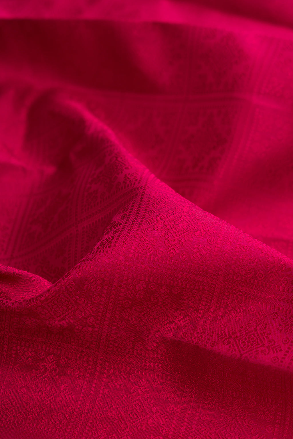 Close up of Pure Silk Pure Zari Maroon Kanjivaram Saree with Jacquard design on the body and Thin Zari Line.  displaying folds