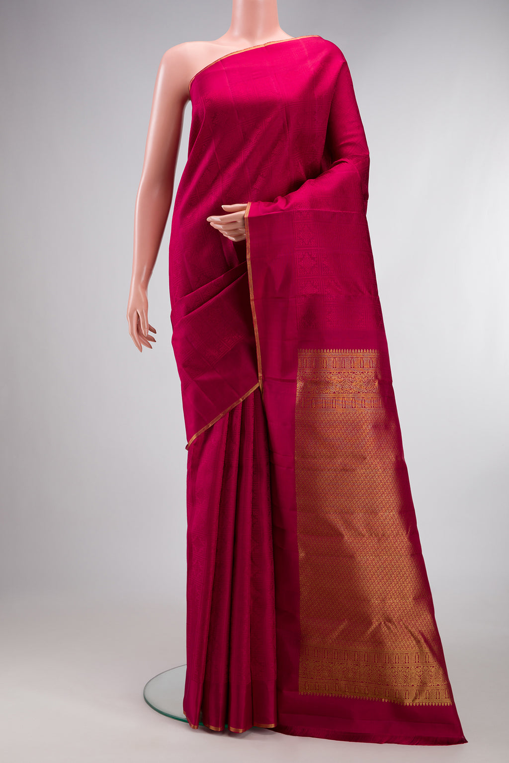 Pure Silk Pure Zari Maroon Kanjivaram Saree with Jacquard design on the body and Thin Zari Line.  displayed on a mannequin