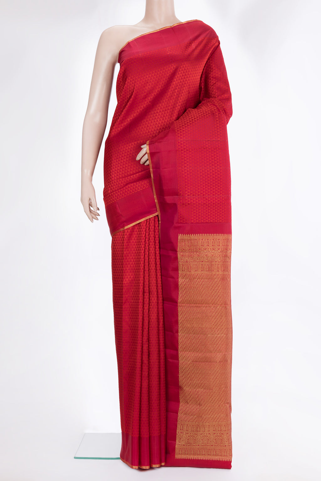 Pure Silk Red Kanjivaram Saree with Jacquard design on the body and Zari Border.  displayed on a mannequin