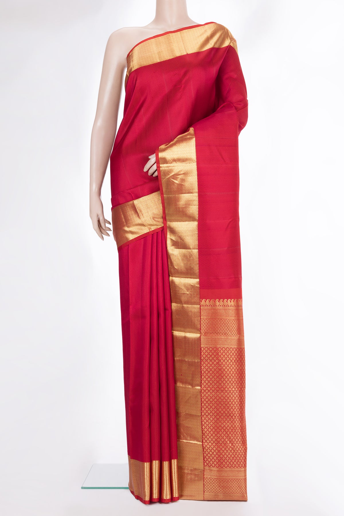 Pure Silk Red Kanjivaram Saree with Jacquard design on the body and Zari Border.  displayed on a mannequin