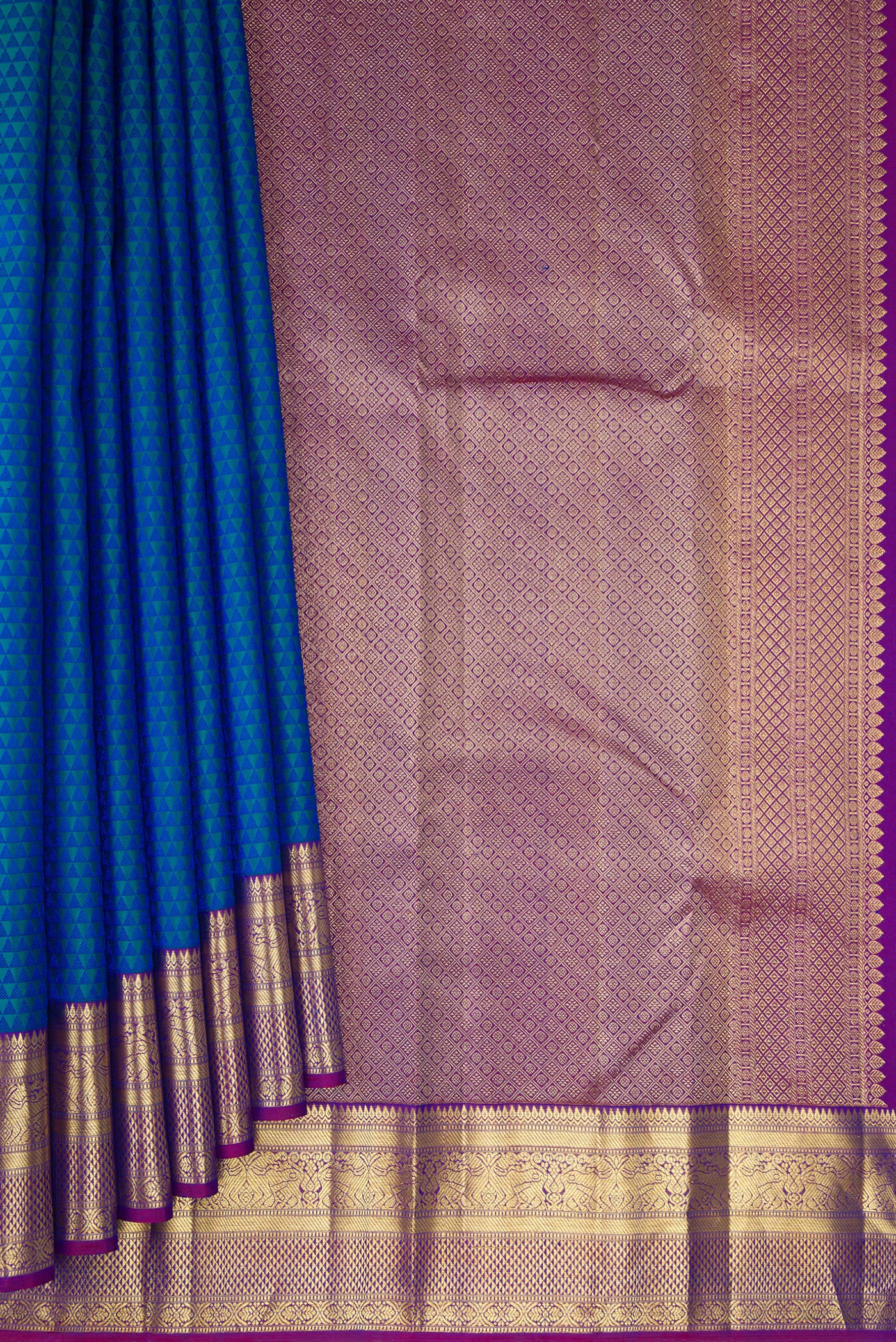 Pleats and pallu of Peacock Blue Dual Tone Kanjivaram Silk Saree with Jacquard design on the body and Zari Border. 