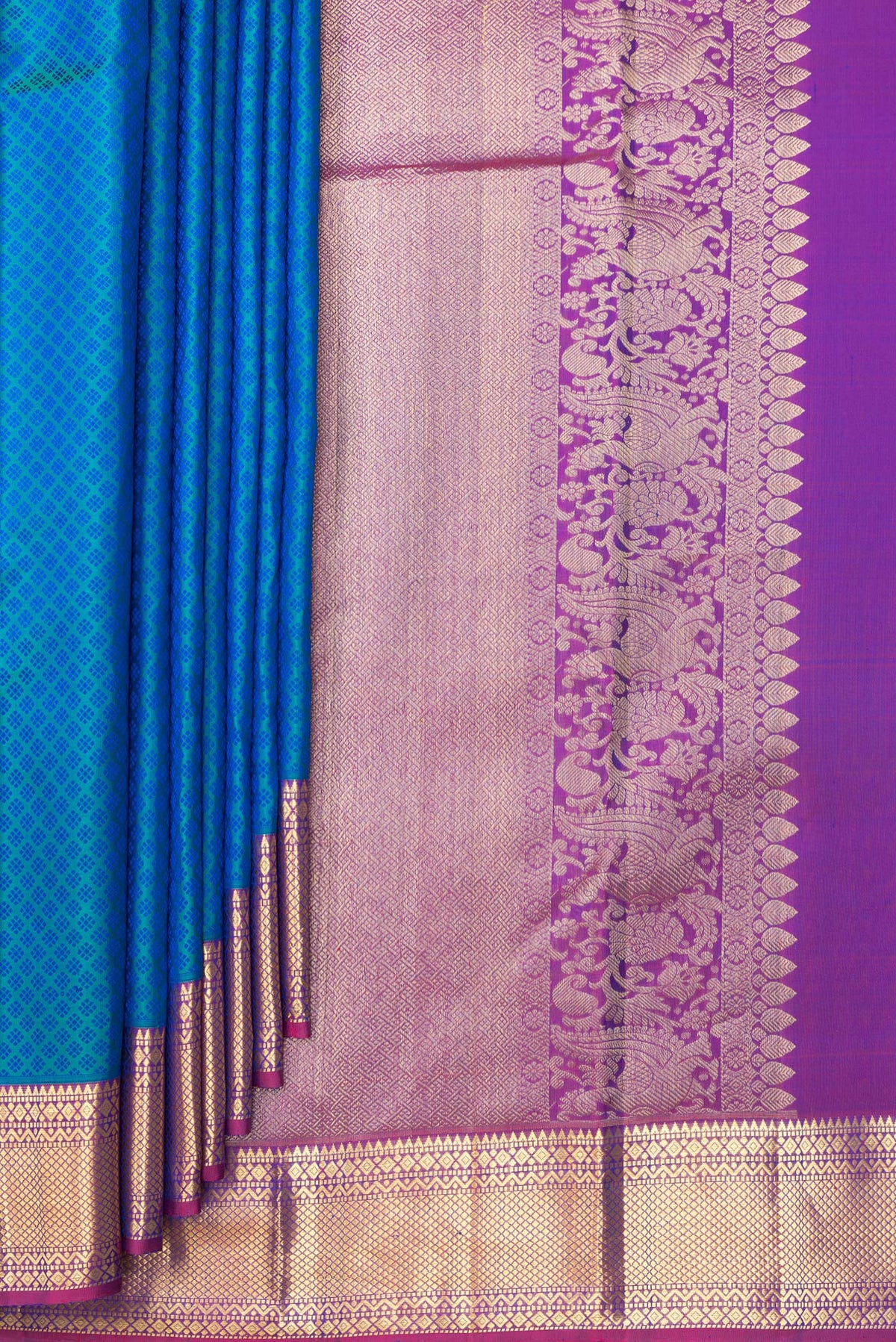 Pleats and pallu of Pure Silk Peacock Blue Dual Tone Kanjivaram Saree with Jacquard design on the body and Zari Border. 