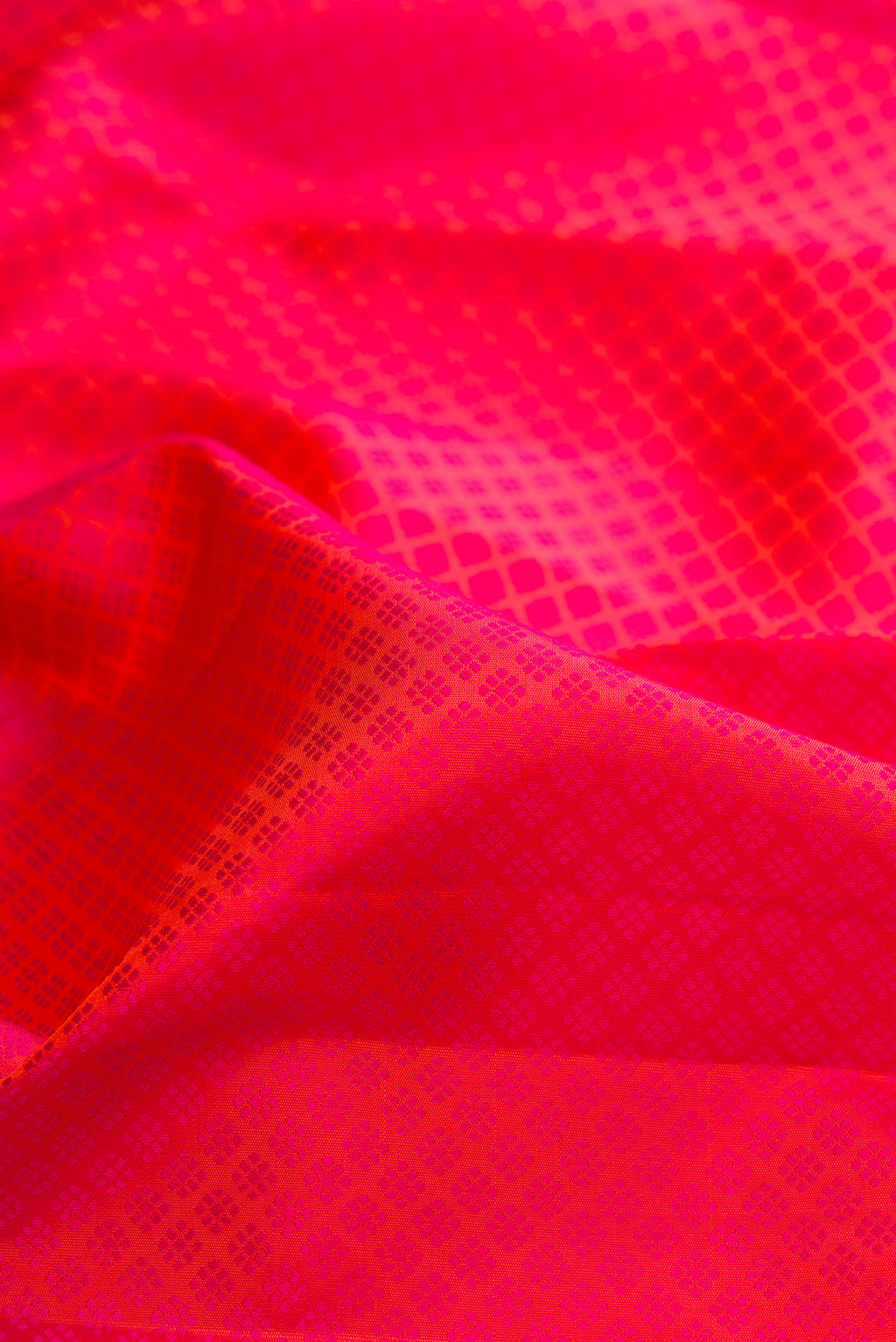 Close up of Pink Dual Tone Kanjivaram Silk Saree with Jacquard design on the body and Zari Border.  displaying folds