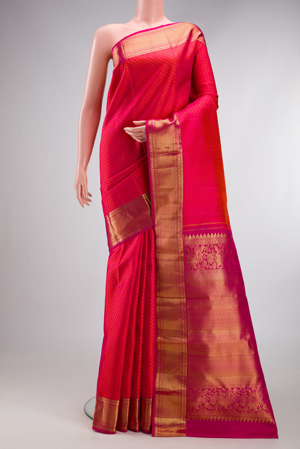 Pink Dual Tone Kanjivaram Silk Saree with Jacquard design on the body and Zari Border.  displayed on a mannequin