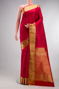 Red Kanjivaram Silk Saree with Jacquard design on the body and Zari Border.  displayed on a mannequin
