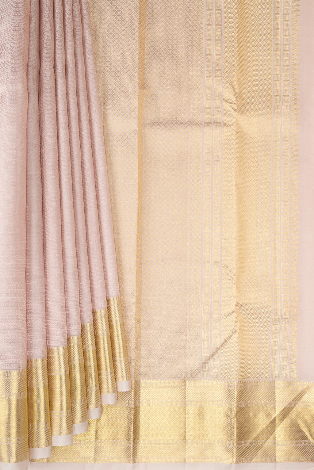 Pleats and pallu of Rose Gold Kanjivaram Silk Saree with Jacquard design on the body and Zari Border. 