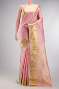 Golden Peach Kanjivaram Silk Saree with Jacquard design on the body and Zari Border.  displayed on a mannequin