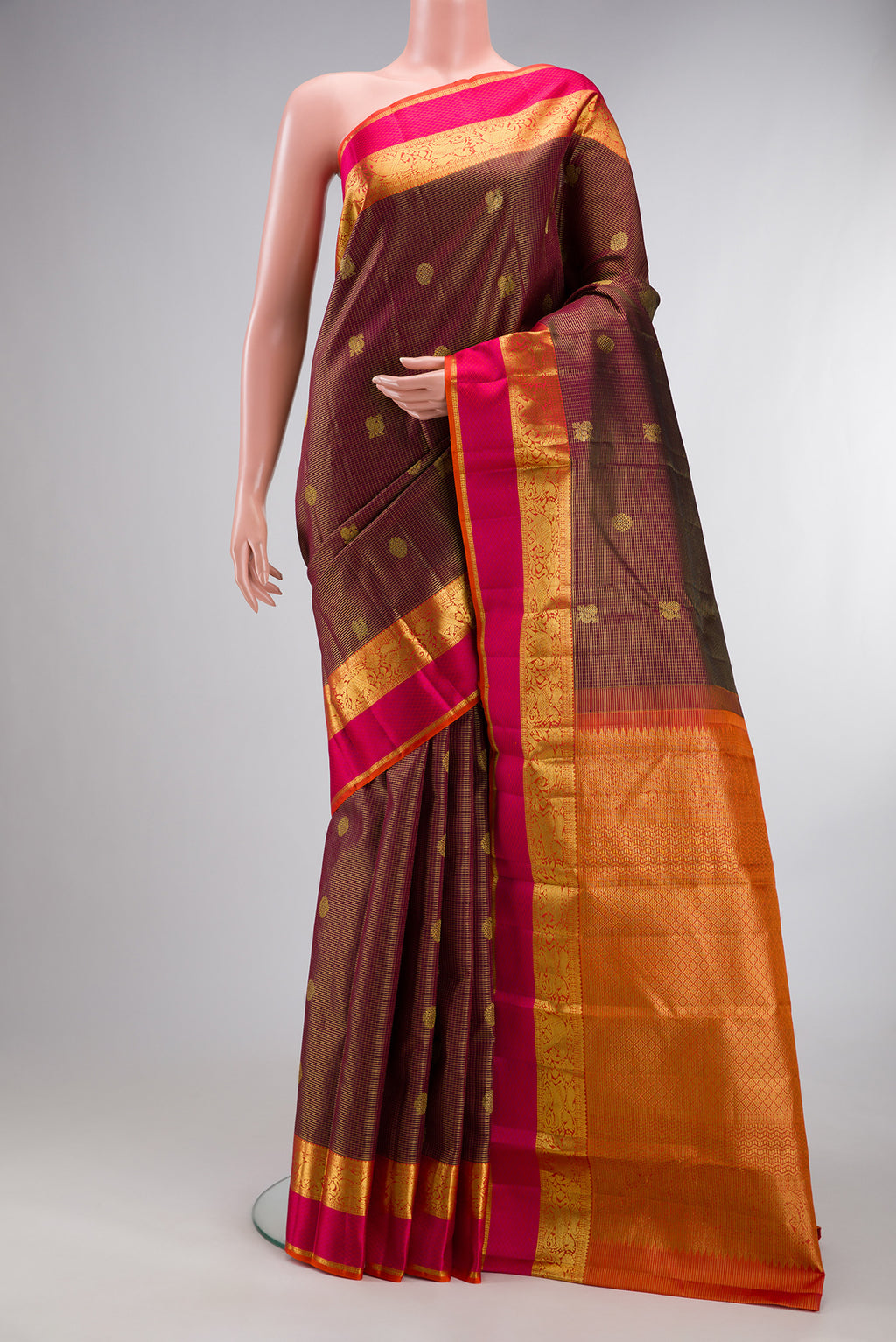 Pure Silk Maroon Kanjivaram Saree with Checked design on the body and Zari Border.  displayed on a mannequin