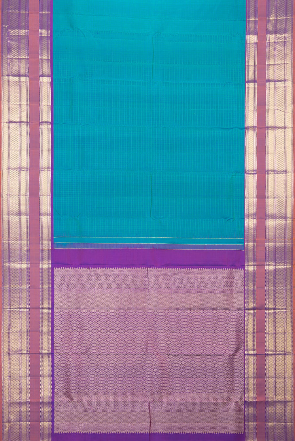 Flat view of Pure Silk Peacock Blue Dual Tone Kanchipuram Saree with Checked design on the body and Zari Border. 