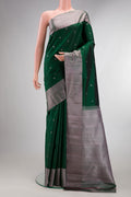 Pure Silk Bottle Green Kanchipuram Saree with Thread Butta on the body and Thread Border.  displayed on a mannequin