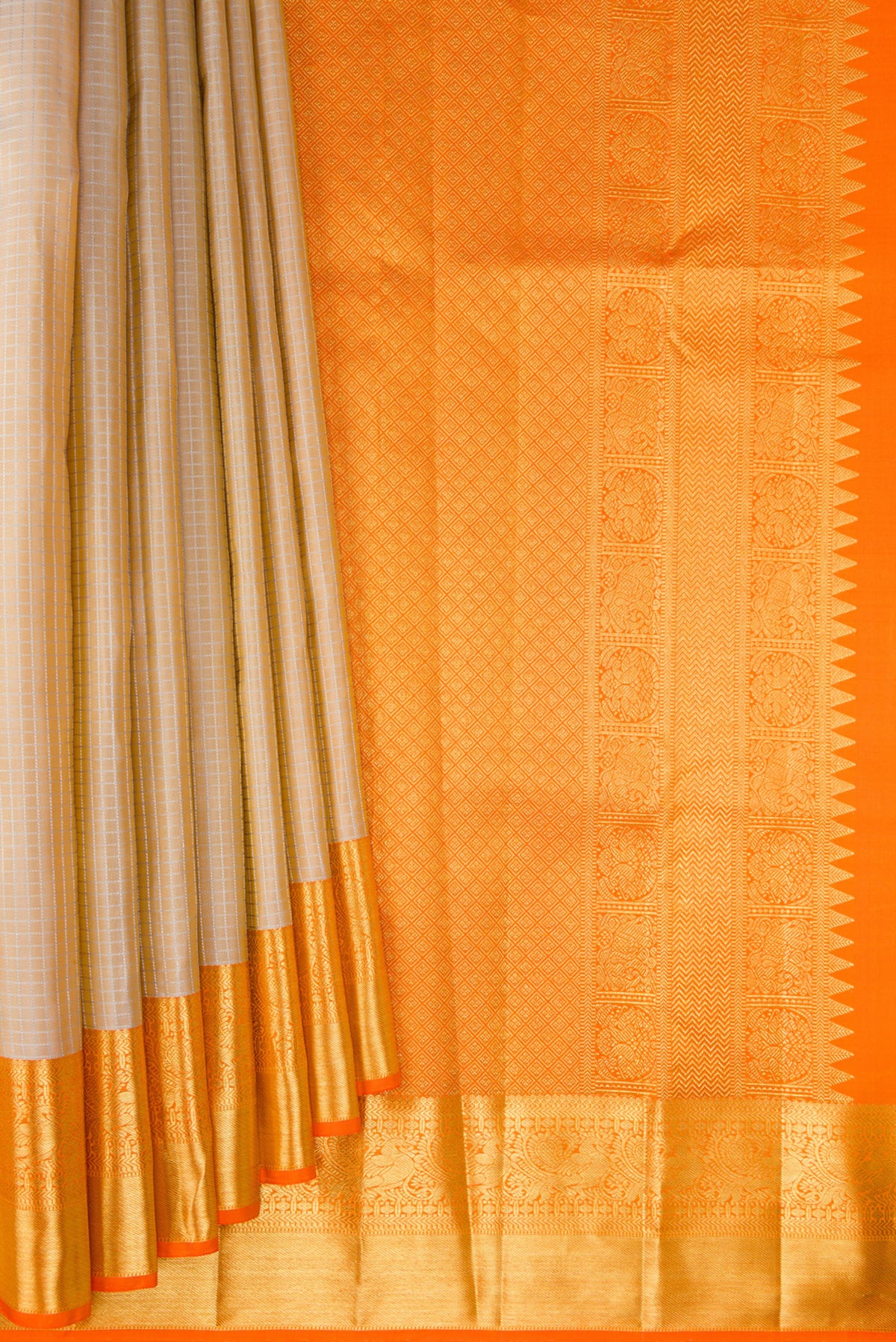 Pleats and pallu of Pure Silk Beige Kanchipuram Saree with Checked design on the body and Zari Border. 