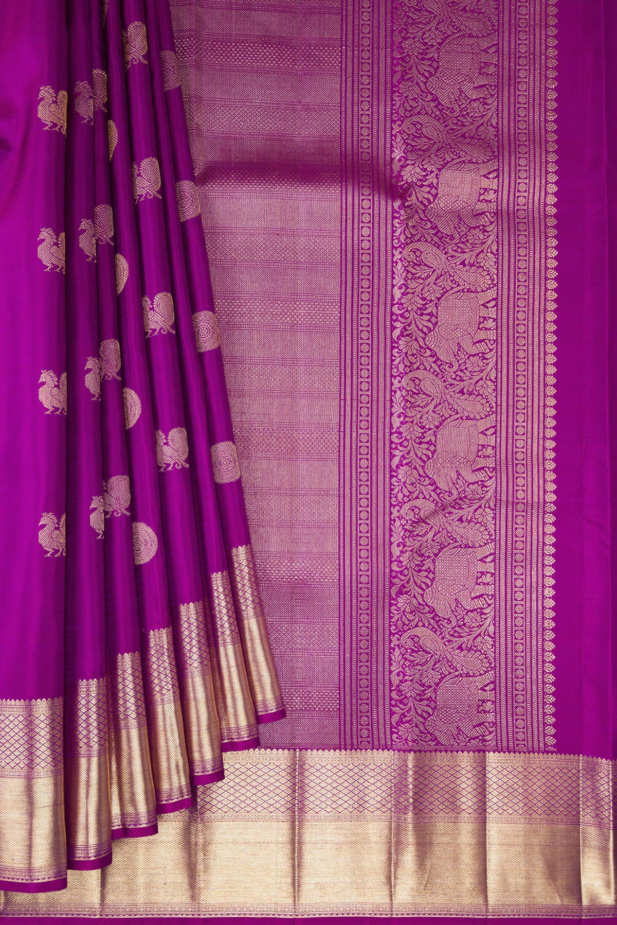 Pleats and pallu of Pure Silk Purple Kanjivaram Saree with Zari Butta on the body and Zari Border. 