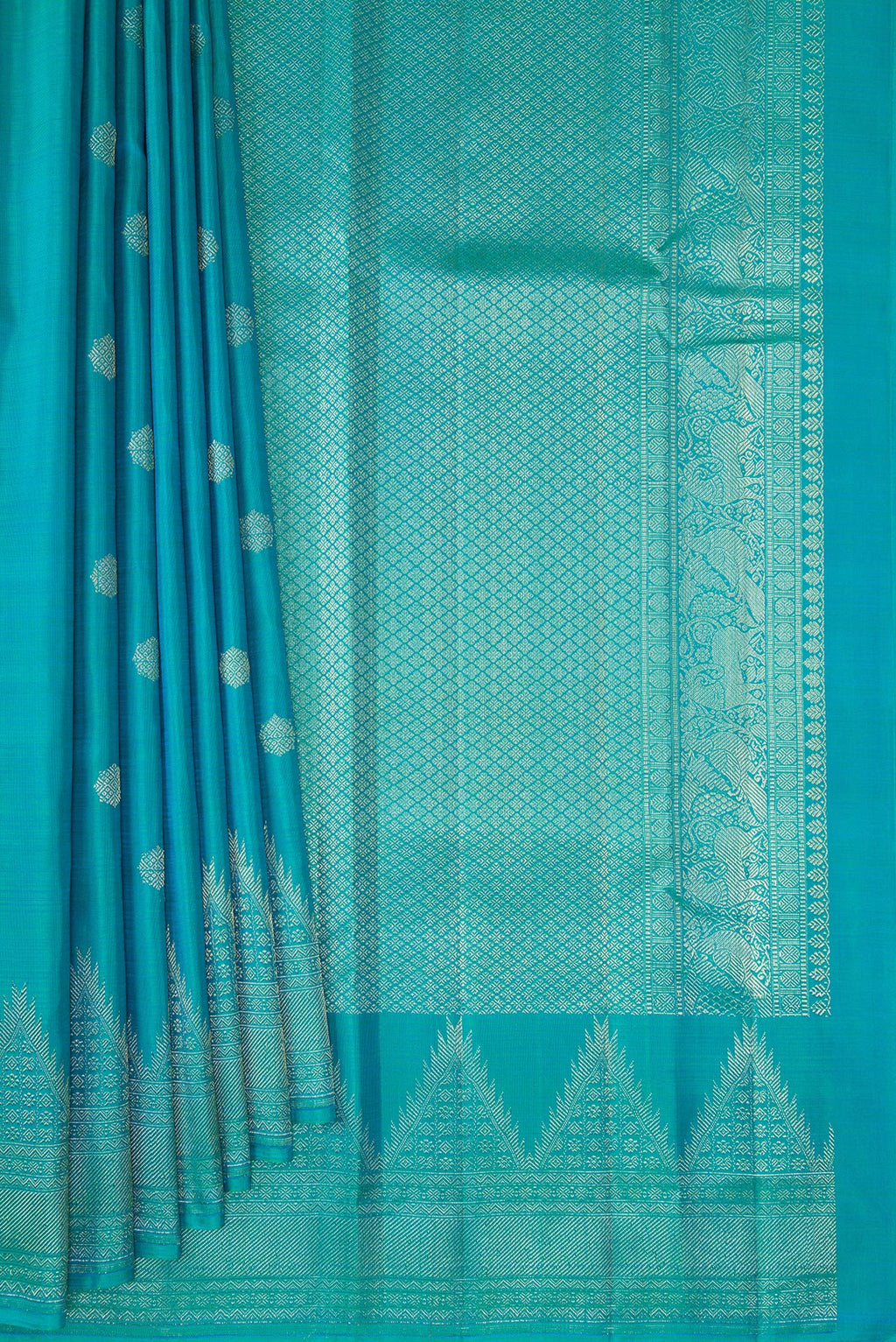 Pleats and pallu of Pure Silk Peacock Blue Kanchipuram Saree with Zari Butta on the body and Temple Border. 
