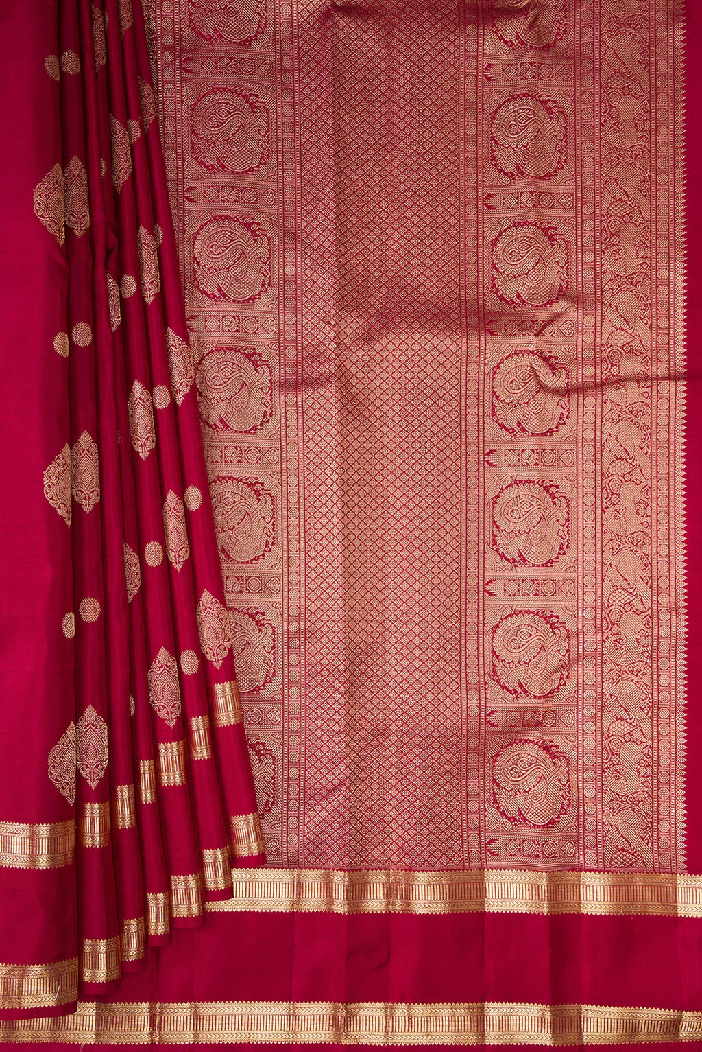 Pleats and pallu of Pure Silk Maroon Kanjivaram Saree with Zari Butta on the body and Zari Border. 