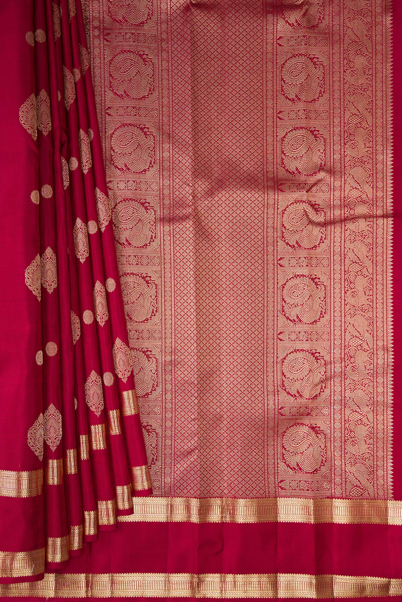 Pleats and pallu of Pure Silk Maroon Kanjivaram Saree with Zari Butta on the body and Zari Border. 