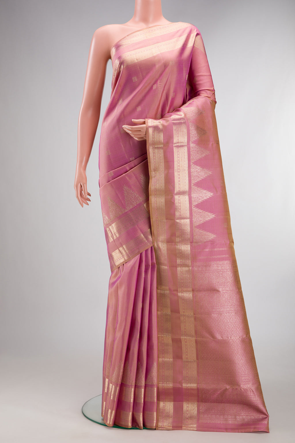 Pure Silk Rose Gold Dual Tone Kanjivaram Saree with Zari Butta on the body and Zari Border.  displayed on a mannequin