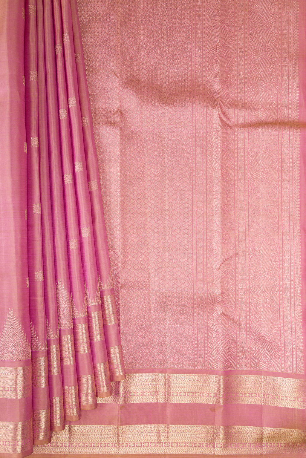 Pleats and pallu of Pure Silk Rose Gold Dual Tone Kanjivaram Saree with Zari Butta on the body and Zari Border. 