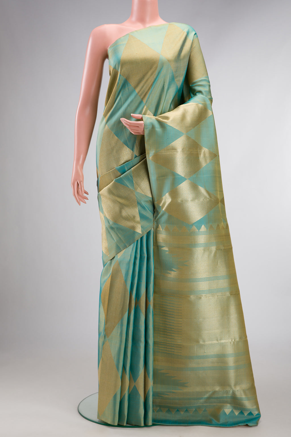 Pure Silk Green Dual Tone Kanchipuram Saree with Zari Brocade on the body and Without Border.  displayed on a mannequin