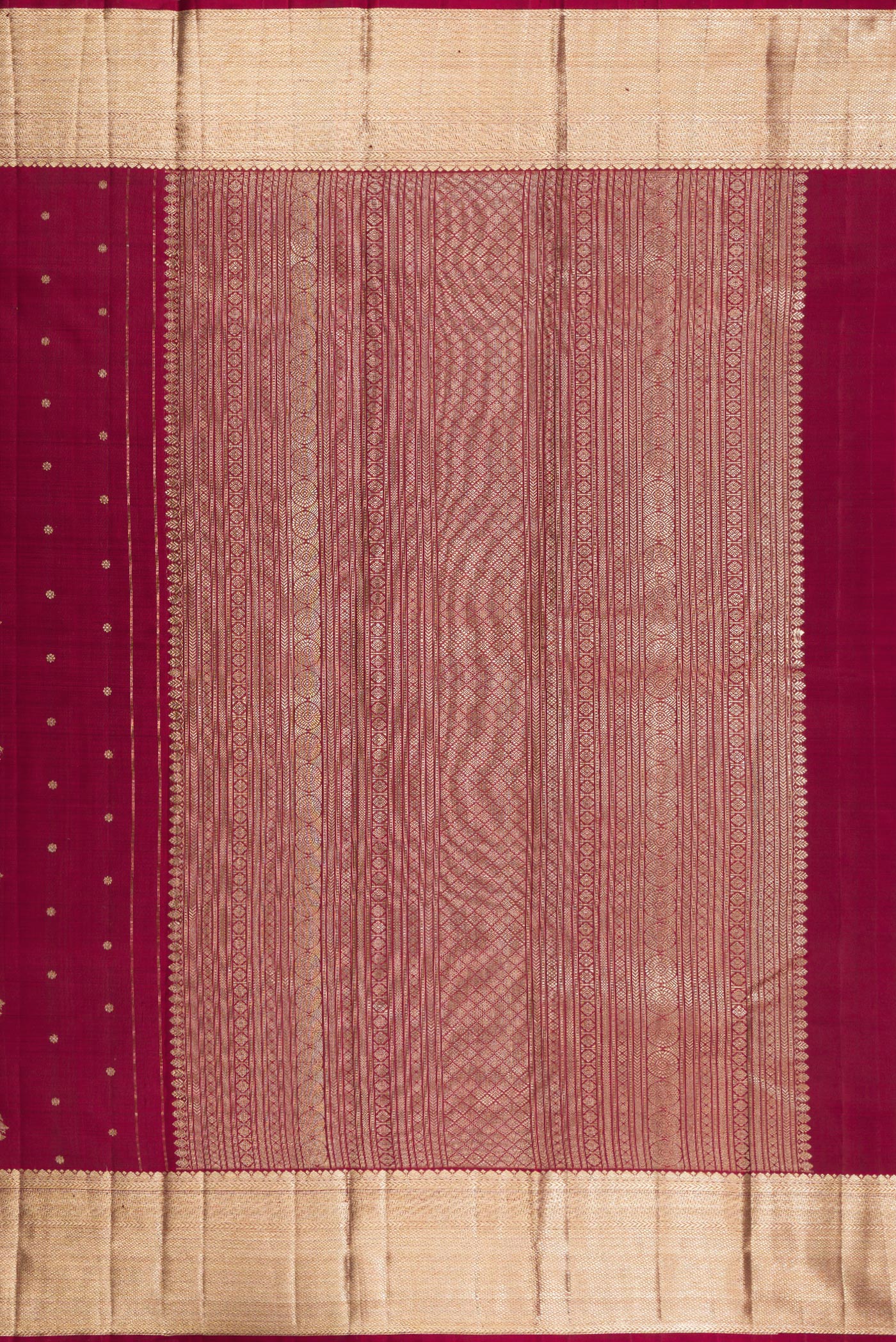 Close up image of the pallu of Pure Silk Maroon Kanjivaram Saree with Zari Butta on the body and Zari Border. 